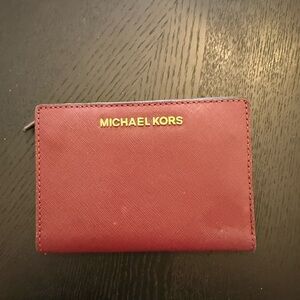 MICHAEL MICHAEL KORS Bryant Medium Pebbled Leather Wallet in a rich oxblood red
